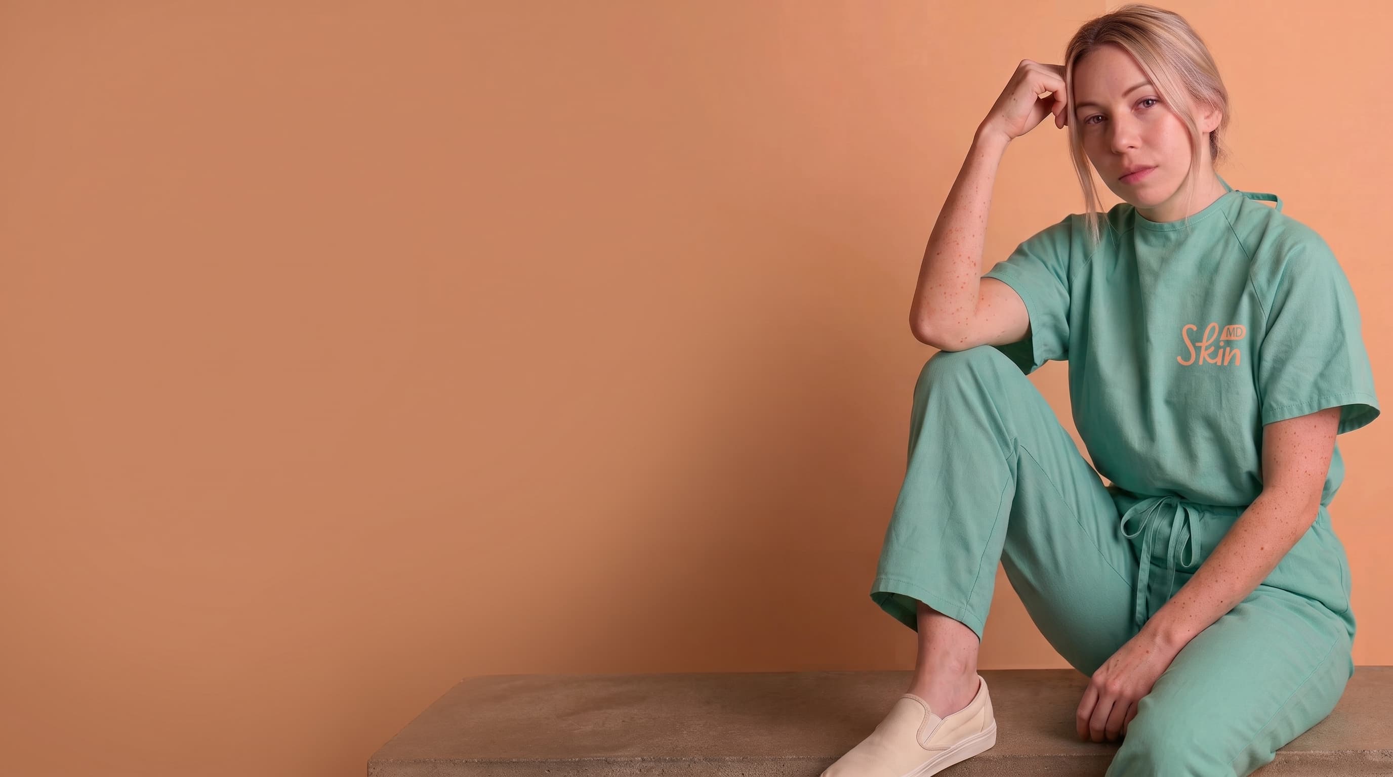 A clinician in a medical gown — captured with SkinMD for assessment and documentation.